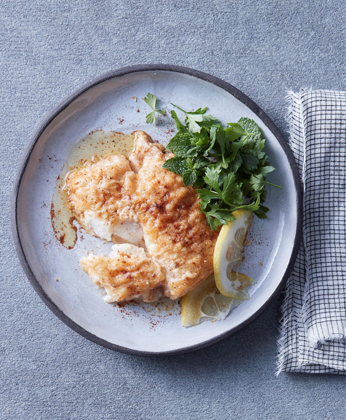Spiced lemon cod with parsley and mint