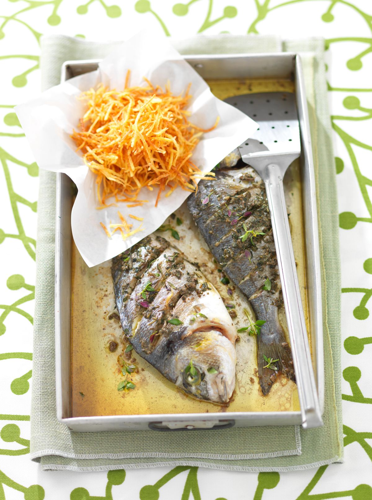 Baked bream with salted anchovies and potatoes