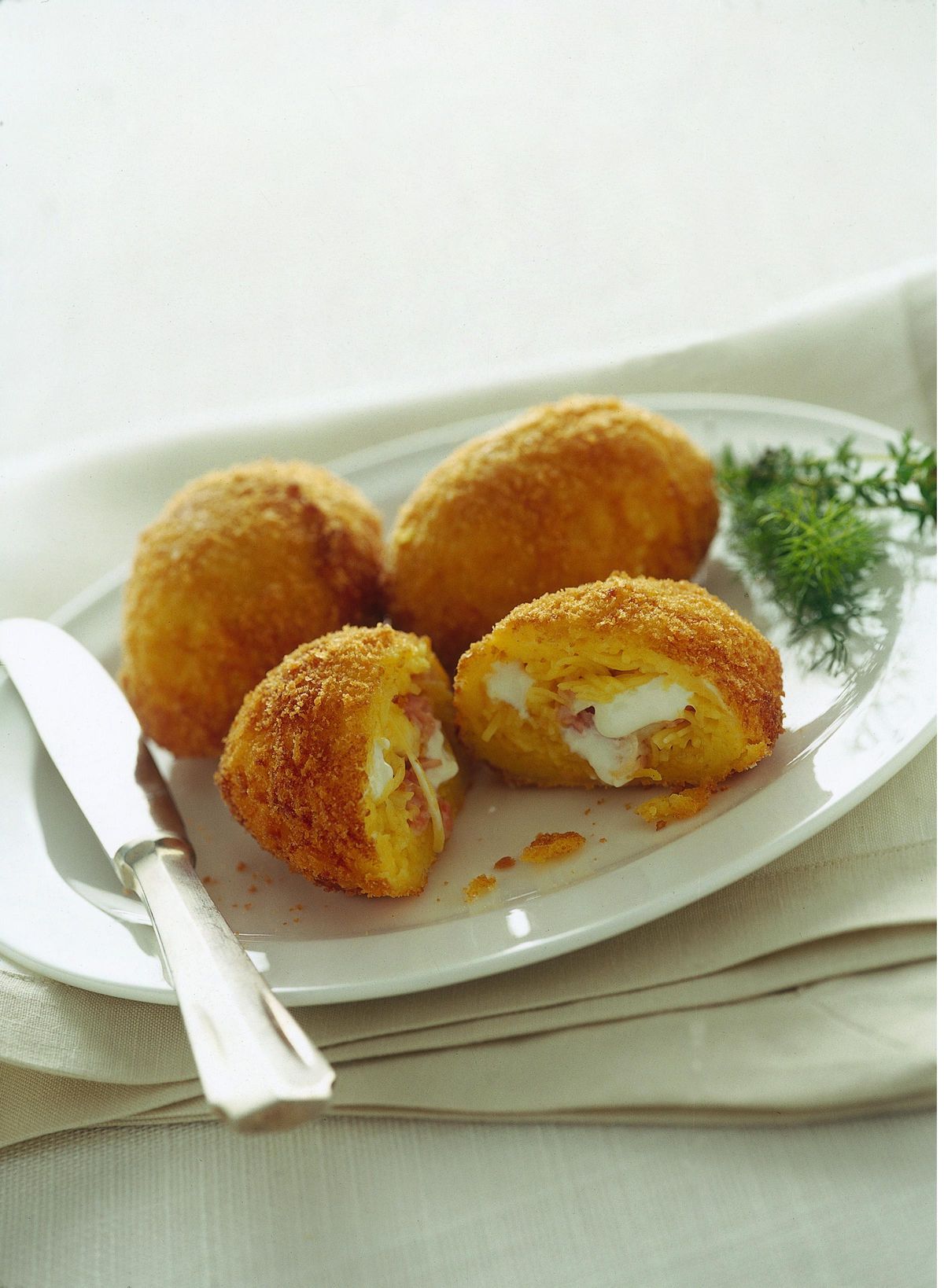 Potato croquettes and hot sausage