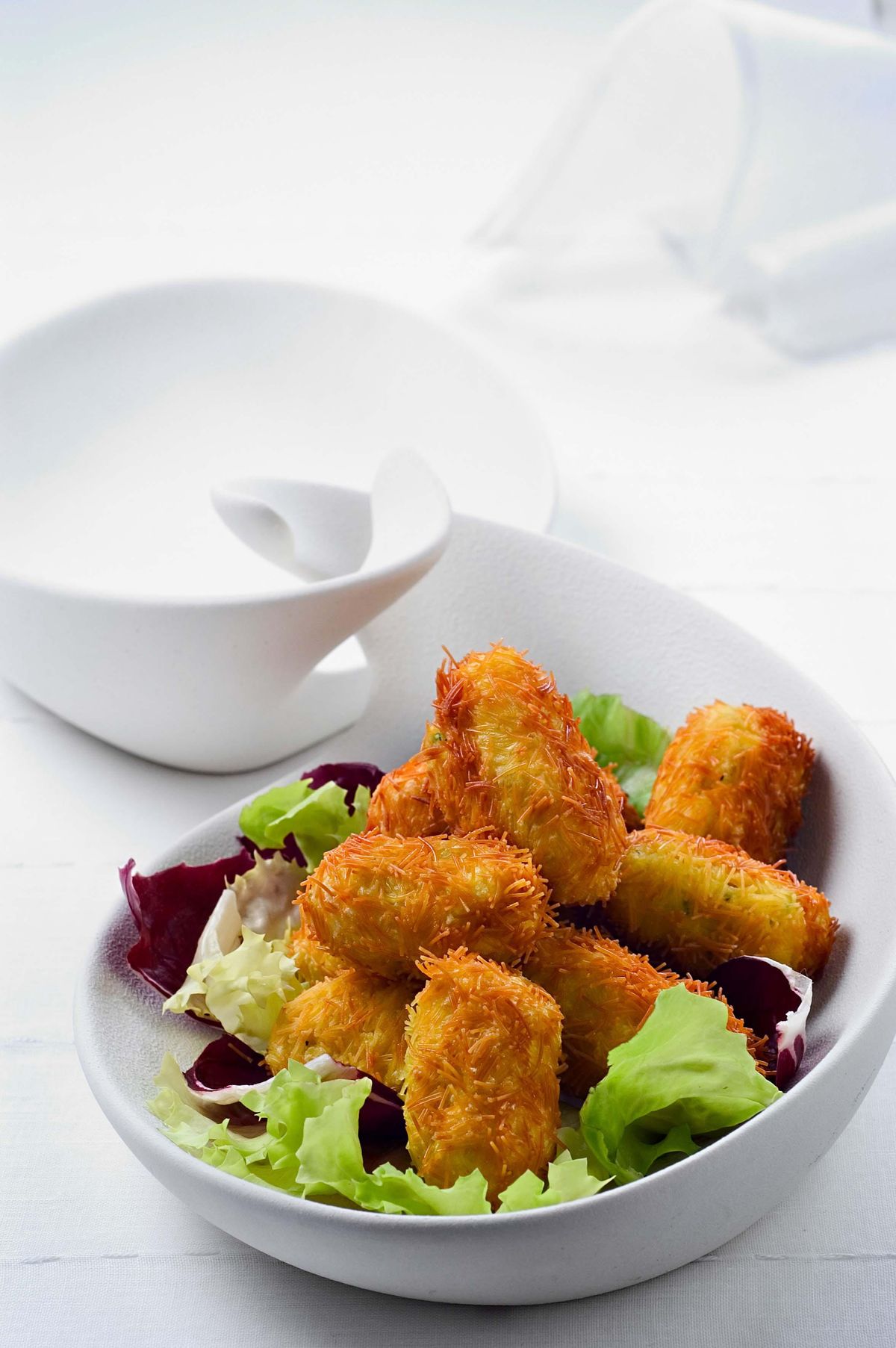 Sea bass croquettes in angel hair crust