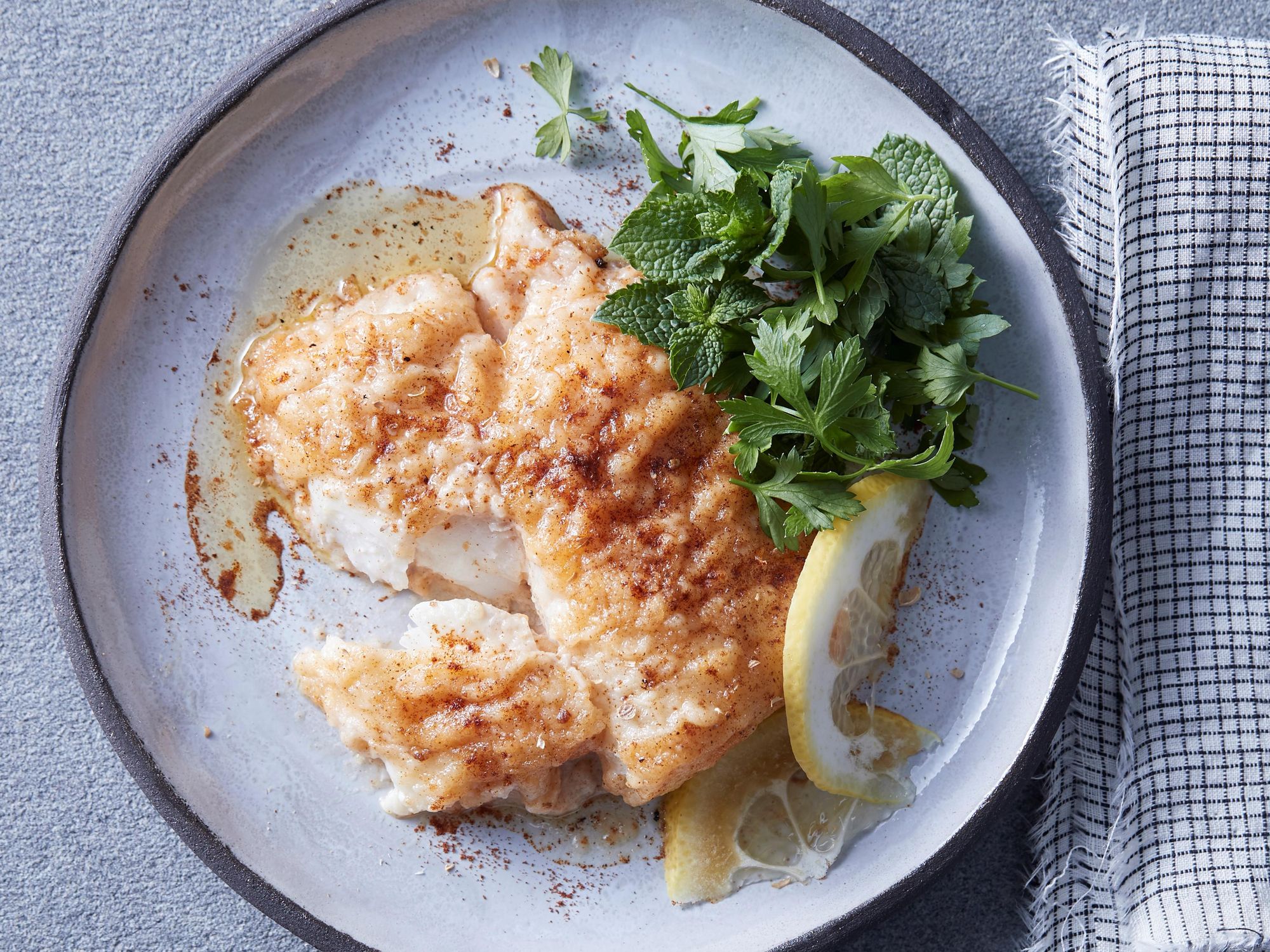 Spiced lemon cod with parsley and mint