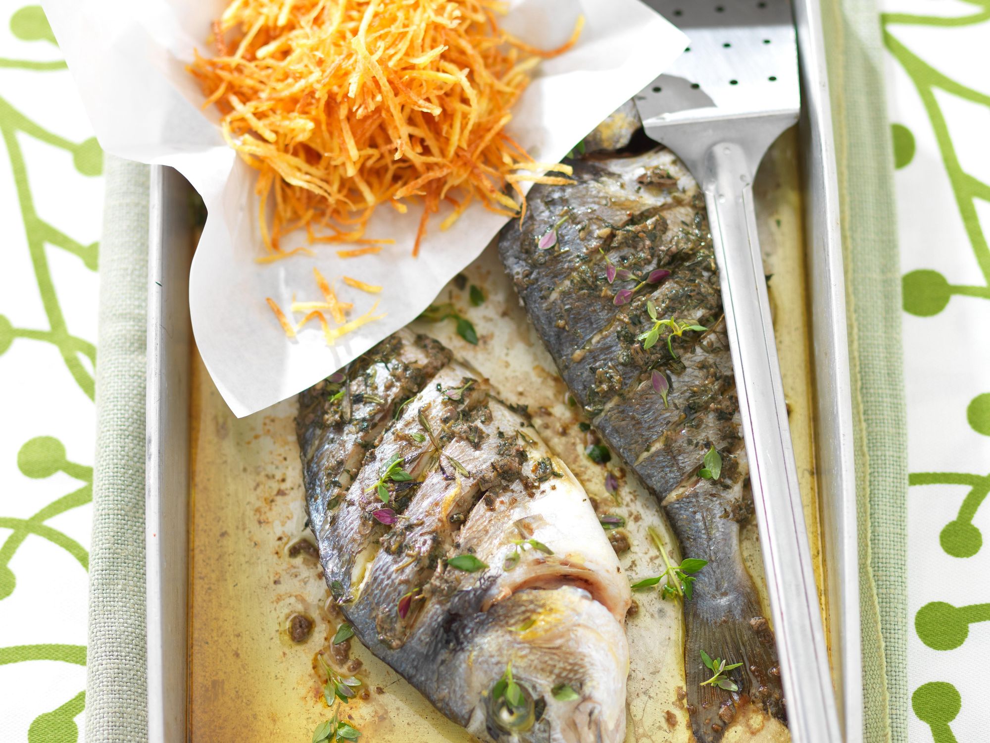 Baked bream with salted anchovies and potatoes