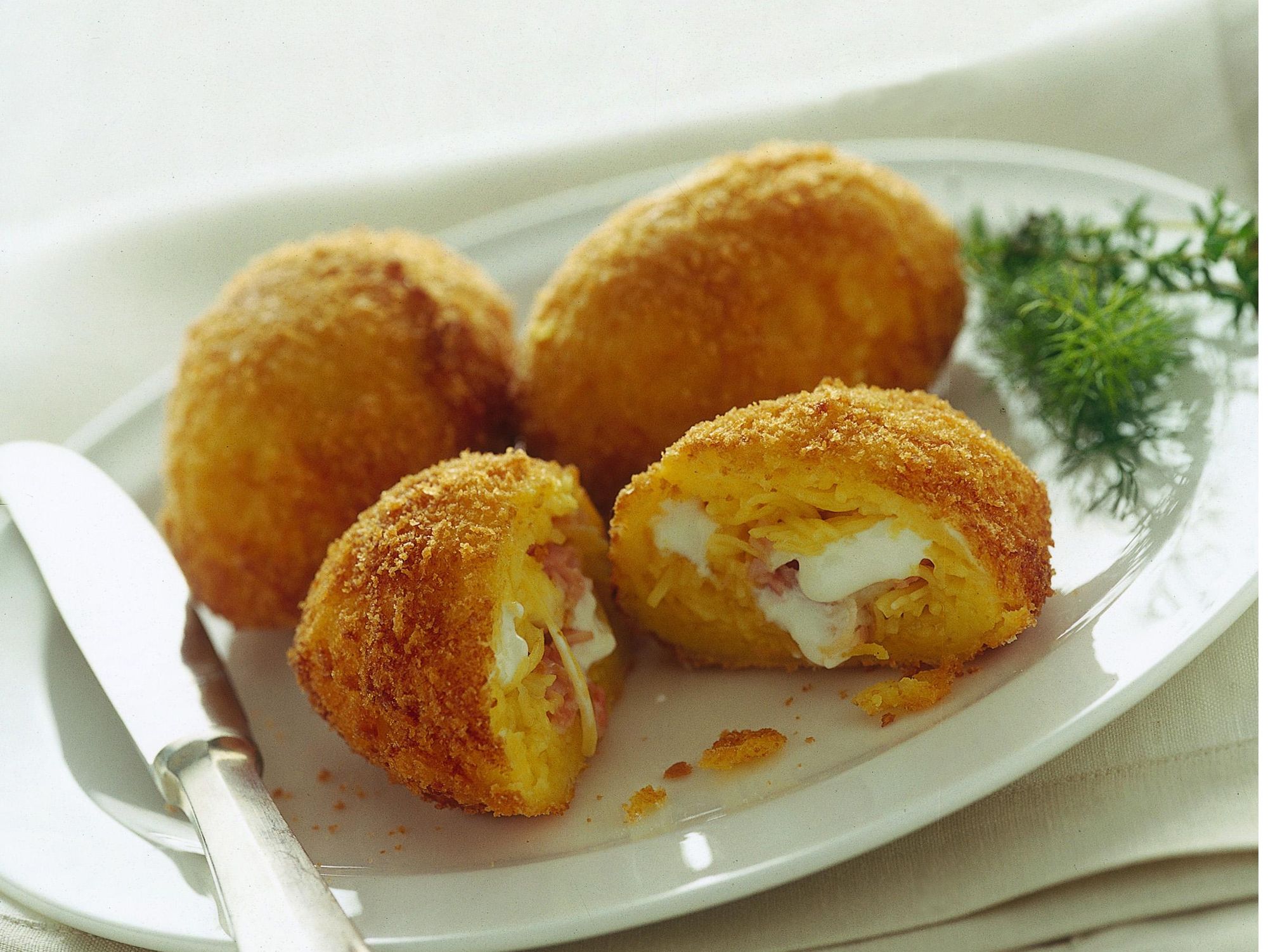 Potato croquettes and hot sausage