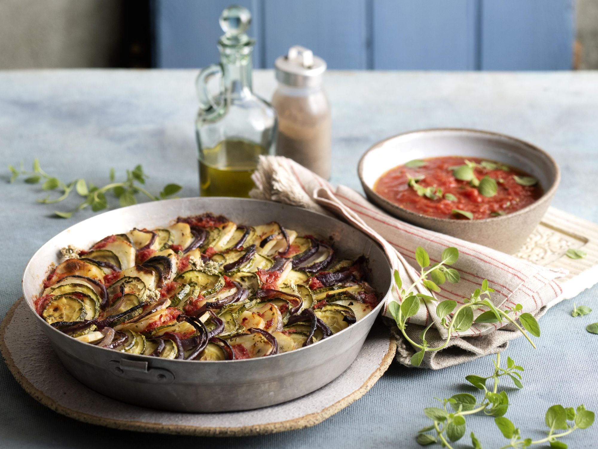 Baked zucchini/courgettes, potatoes, tomatoes and red onion