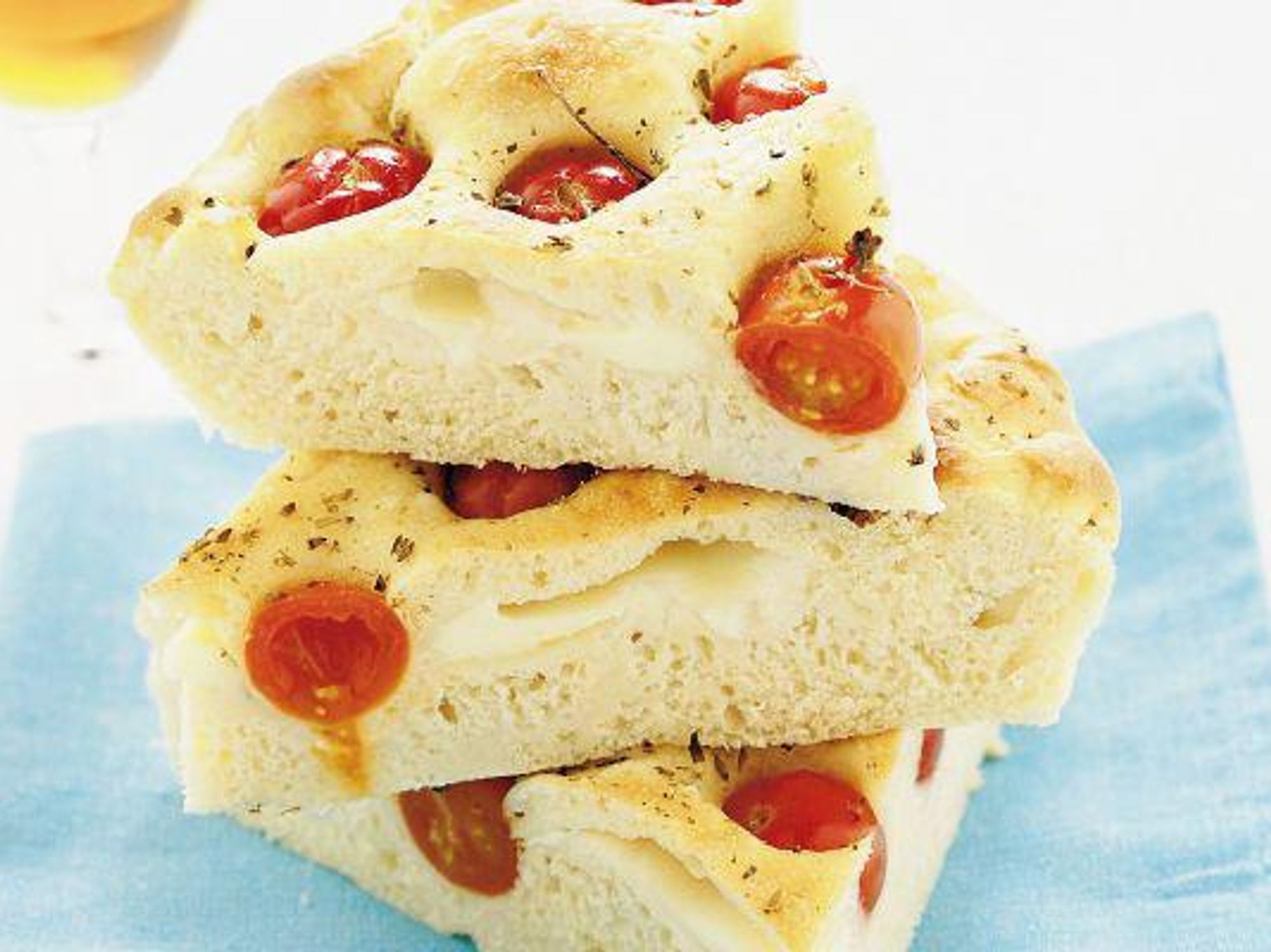 Pizza with potatoes, mozzarella and cherry tomatoes