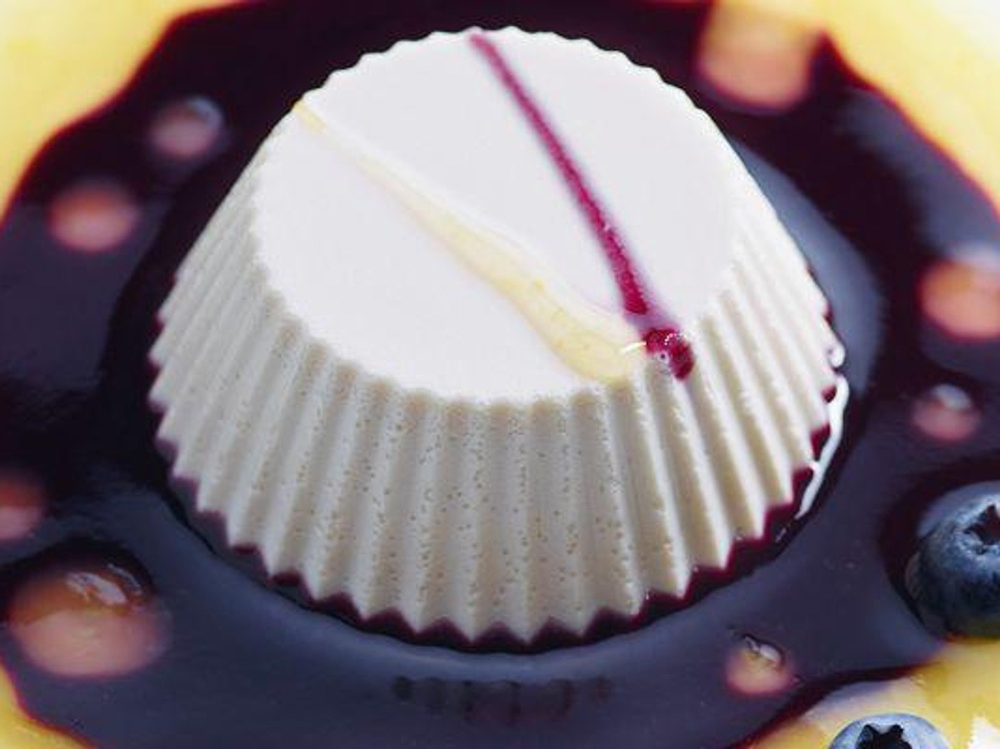 Vegan panna cotta with orange and blueberry cream