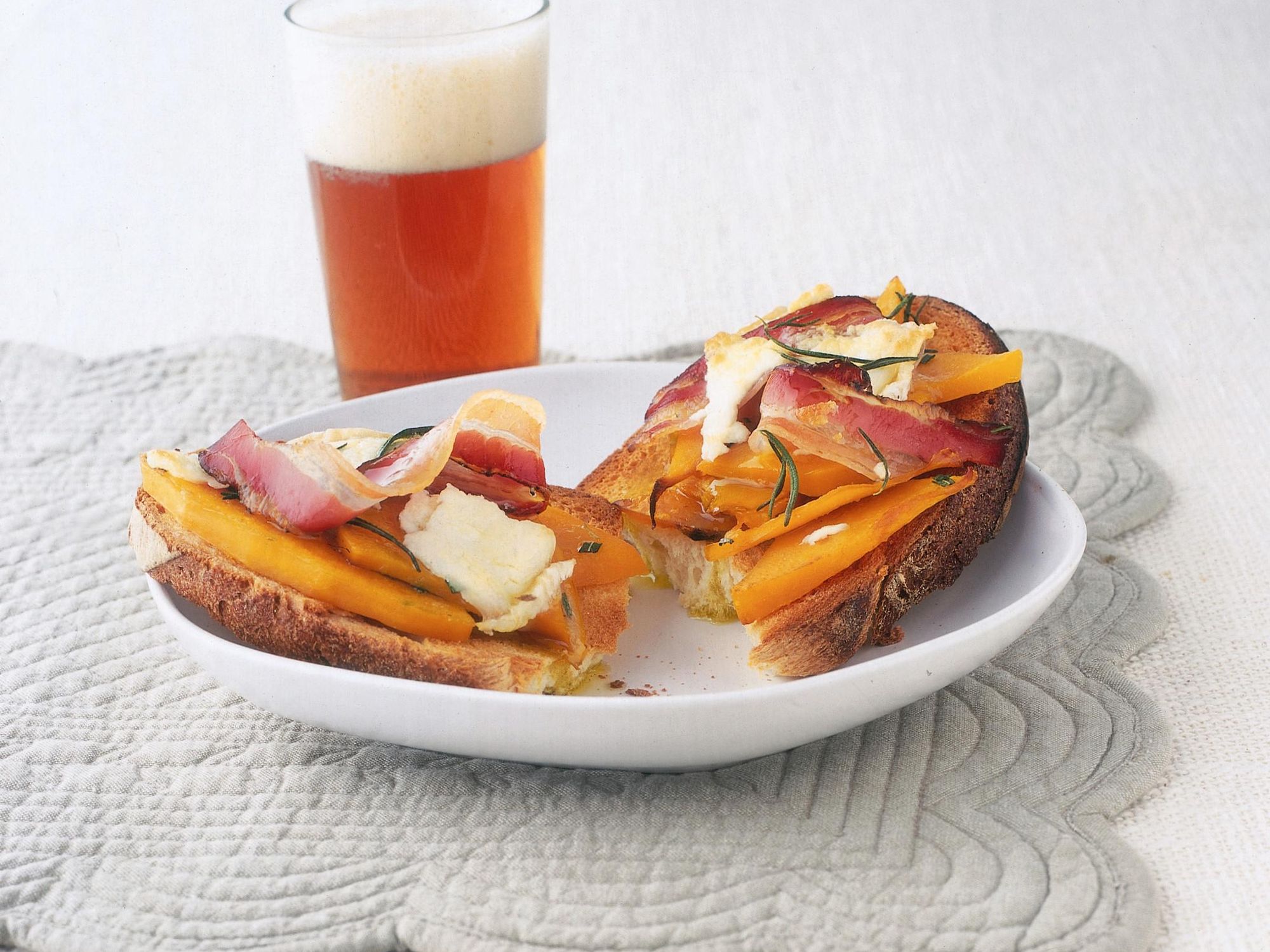 Bruschetta with pumpkin, bacon, and goat cheese
