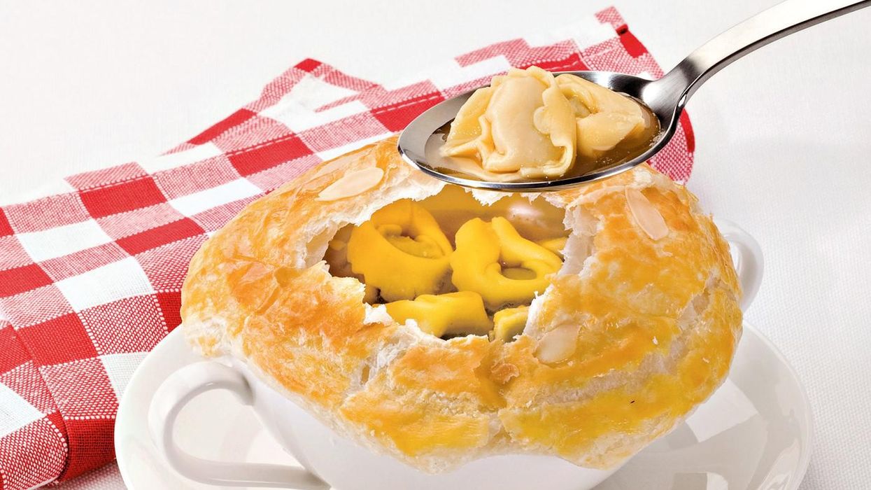 Tortellini in broth with puff pastry crust